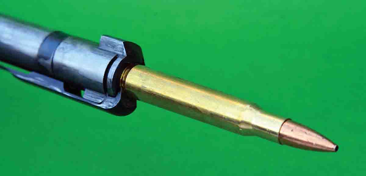 Note how the claw extractor literally holds the cartridge against the bolt face, which is the heart of a control-round feed action.